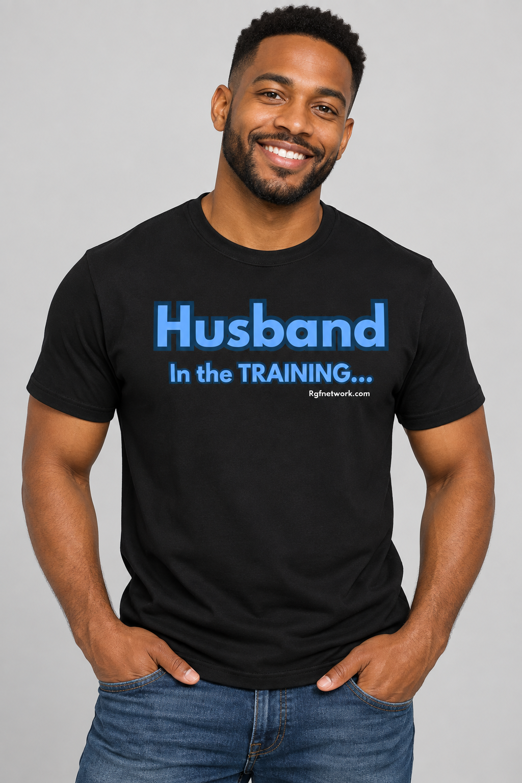 Man wearing the black Husband in Training shirt with blue lettering